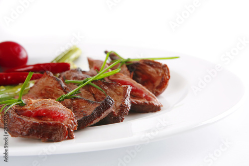 meat slices on white dish