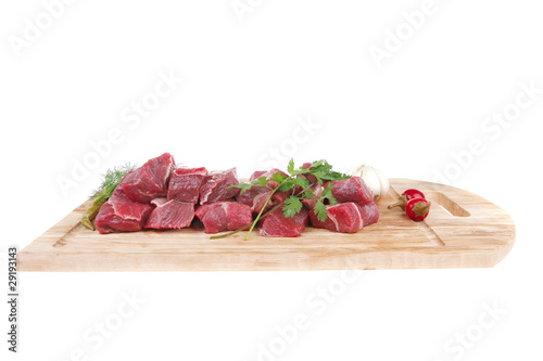 beef meat fillet on a wooden plate with dill