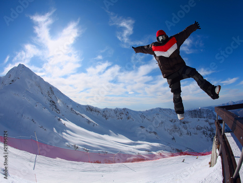 Snowboarder in the free jumping