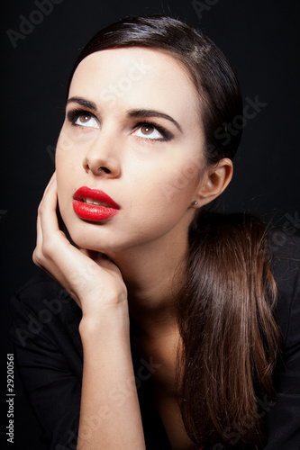 Beautiful young woman with bright red lipstick