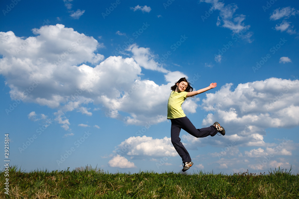 Girl jumping, running against blue sky Girl jumping, running against blue sky