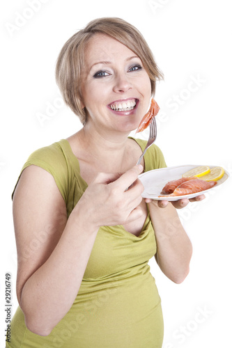 pregnant woman eats smoked salmon