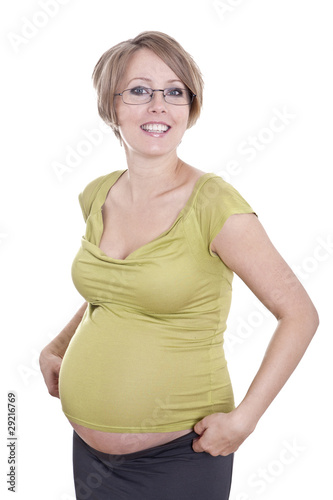 Pregnant pretty woman in studio over white background