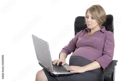 young pregnant business woman at work