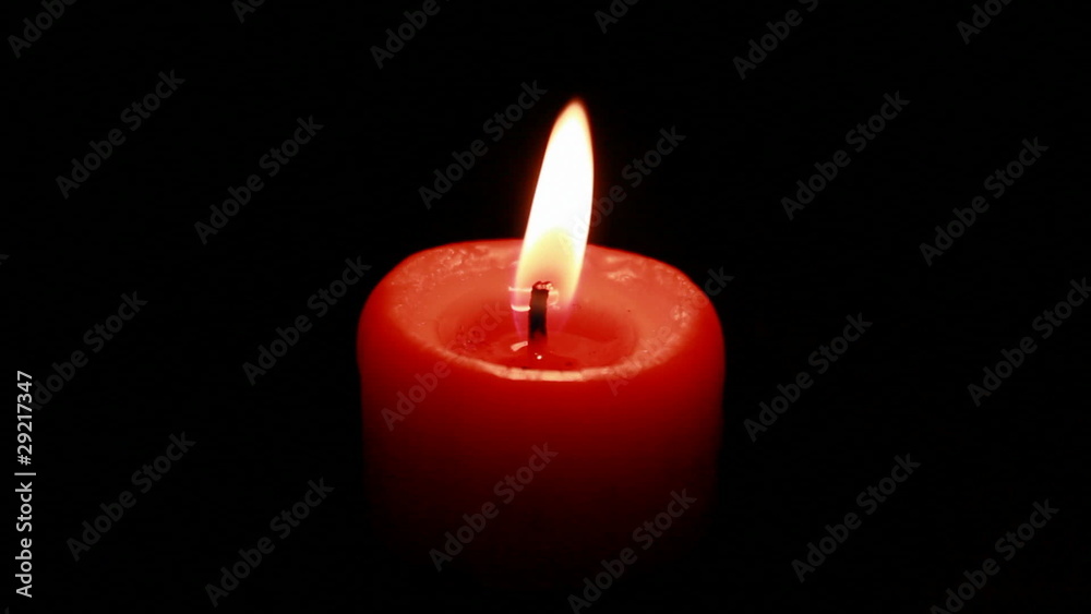 burning candle isolated on black burning candle isolated on black