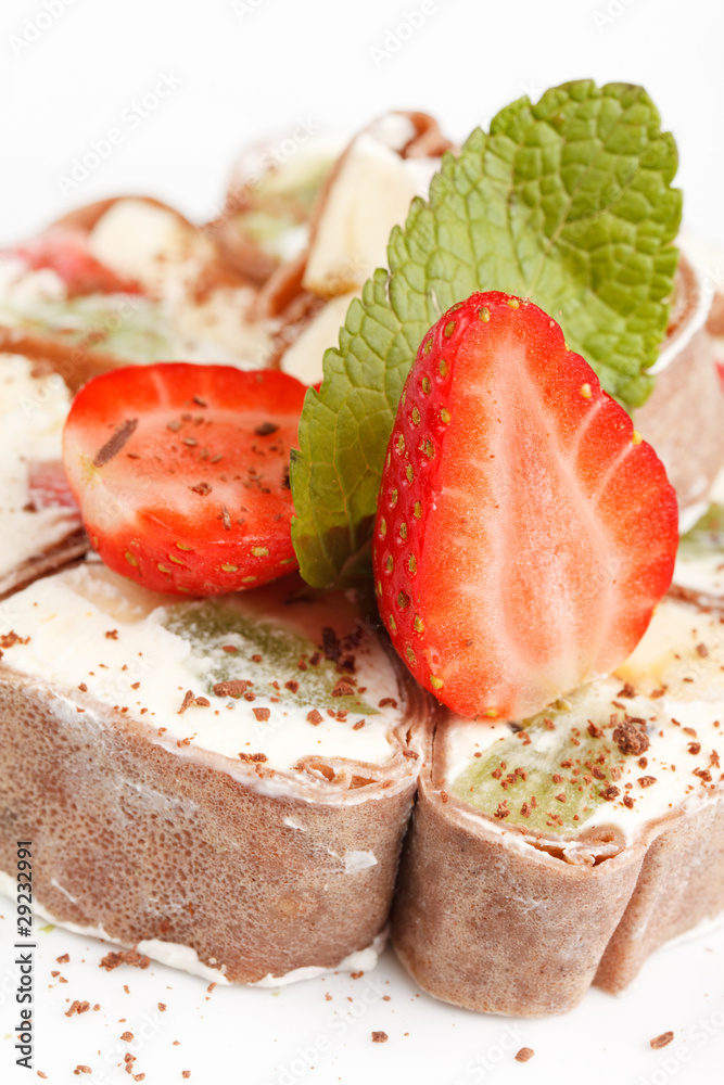 Tiramisu Sushi Roll garnished with Strawberry and Mint Tiramisu Sushi Roll garnished with Strawberry and Mint