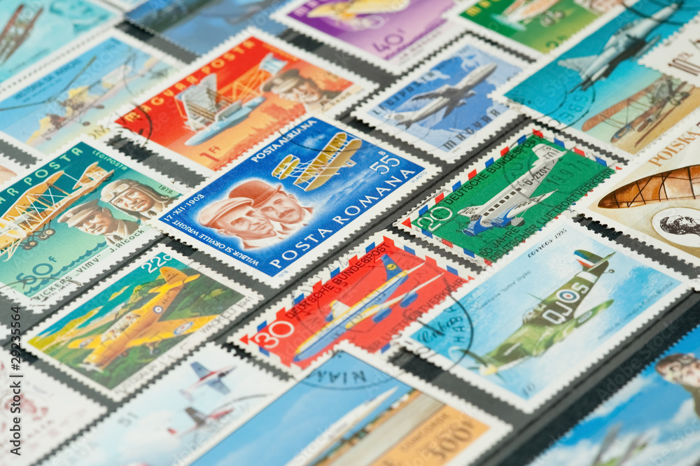 collection of aviation themed stamps in an album