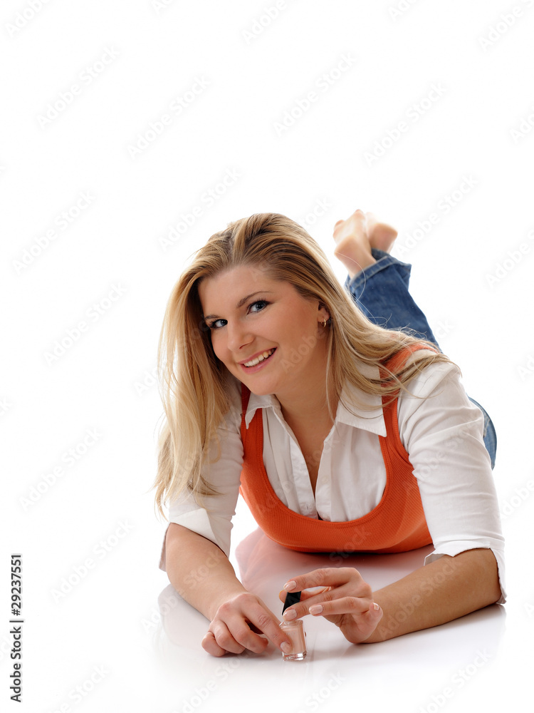 Beautiful girl relaxing and applying nail manicure Beautiful girl relaxing and applying nail manicure