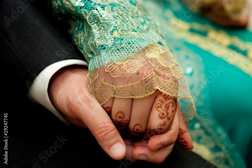 Close up of wedding couple's hands photo