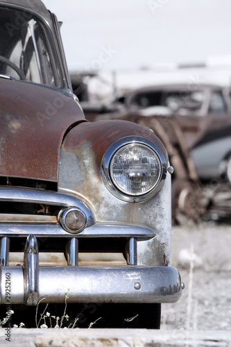 Old rustic cars in a scrap yard