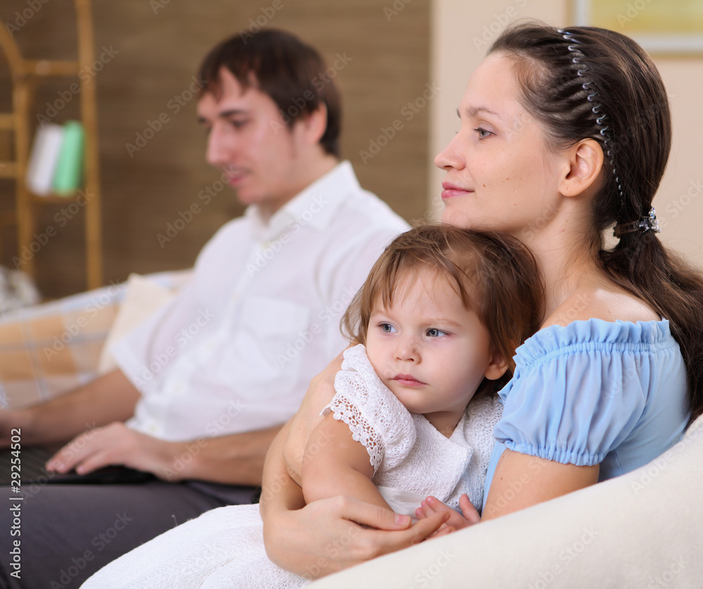 young mother with a daughter at home