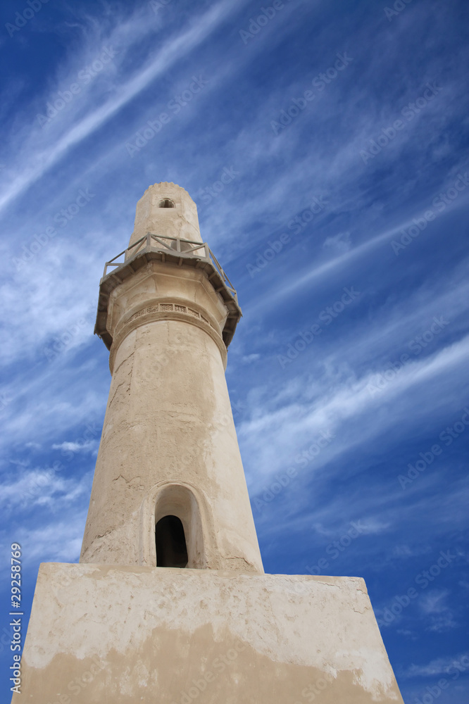 A minaret of Al Khamis Mosque, viewing upward