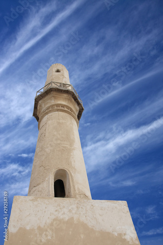 A minaret of Al Khamis Mosque, viewing upward