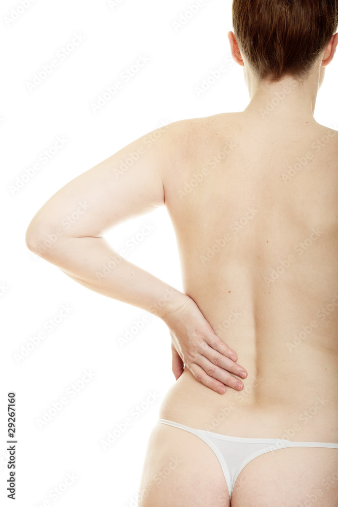 Woman massaging pain back isolated over a white background Woman massaging pain back isolated over a white background