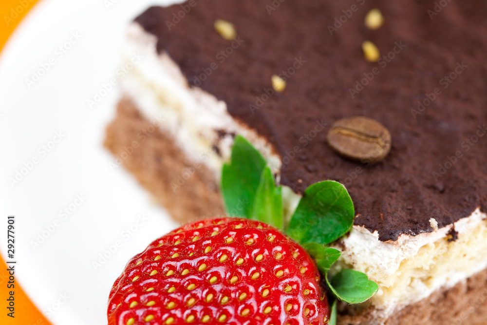 cake on a plate and strawberries lying on the orange fabric cake on a plate and strawberries lying on the orange fabric