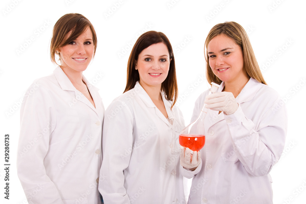Group of three female researchers students standing against whit Group of three female researchers students standing against whit