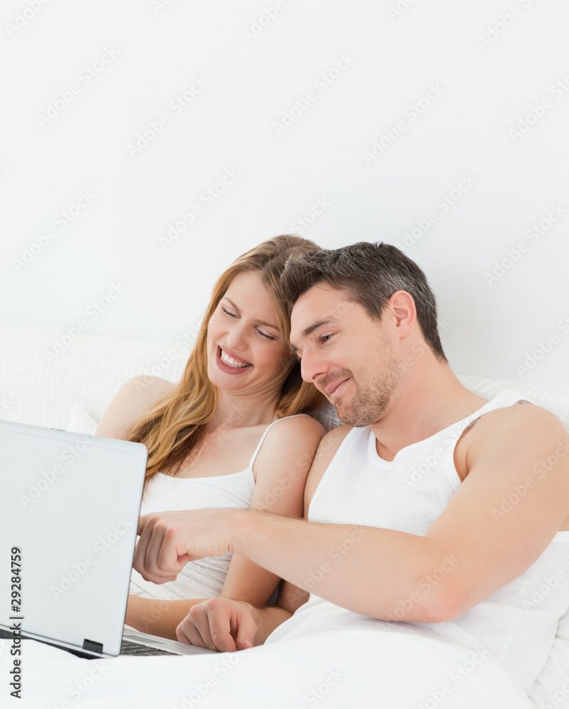 Lovers watching a movie on their laptop Lovers watching a movie on their laptop