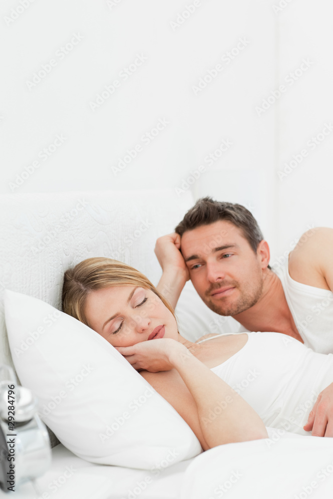 Boyfriend looking at his girlfriend who is sleeping Boyfriend looking at his girlfriend who is sleeping