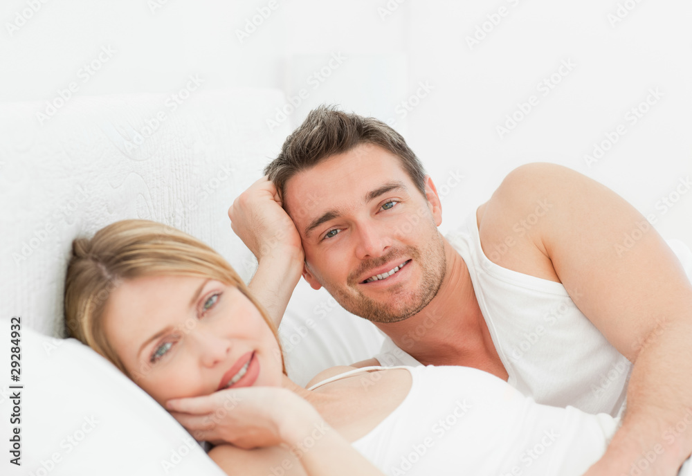 Lovely pairs lying down together in their bed Lovely pairs lying down together in their bed