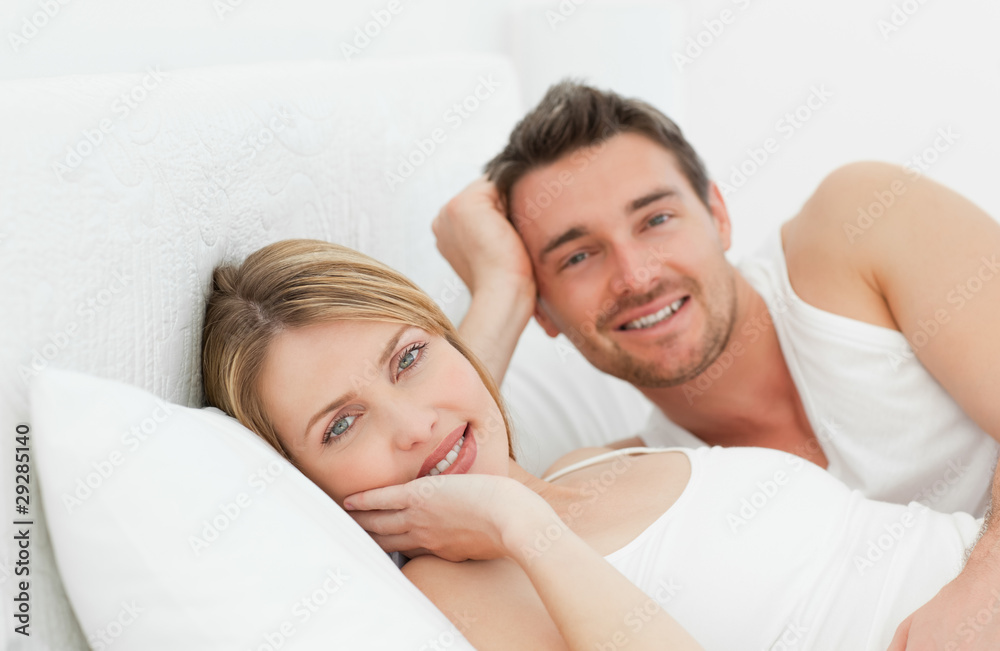 Lovely pairs lying down together in their bed Lovely pairs lying down together in their bed