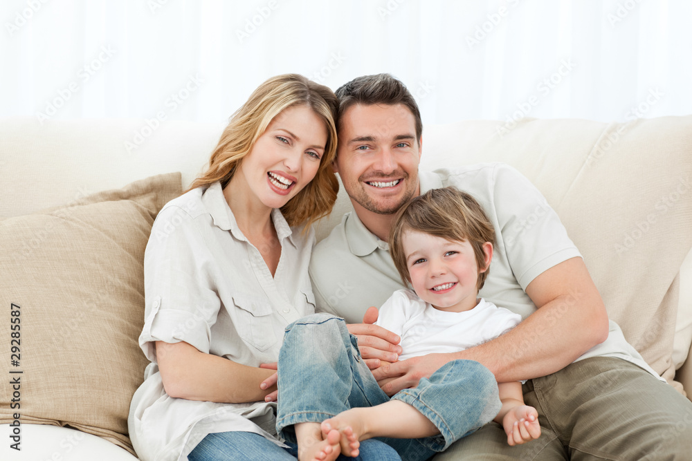 Happy family on their sofa