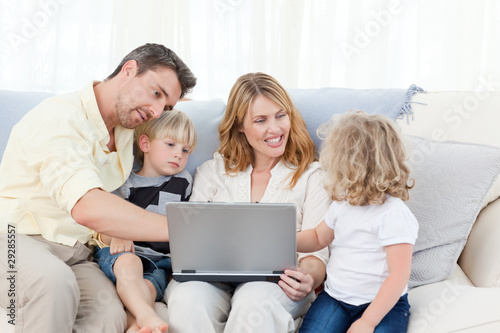 Family looking at their laptop