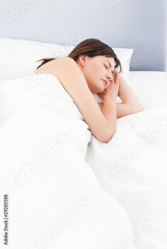 Woman sleeping in her bed