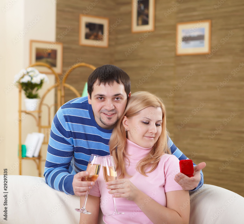 couple with glasses of champagne at home couple with glasses of champagne at home