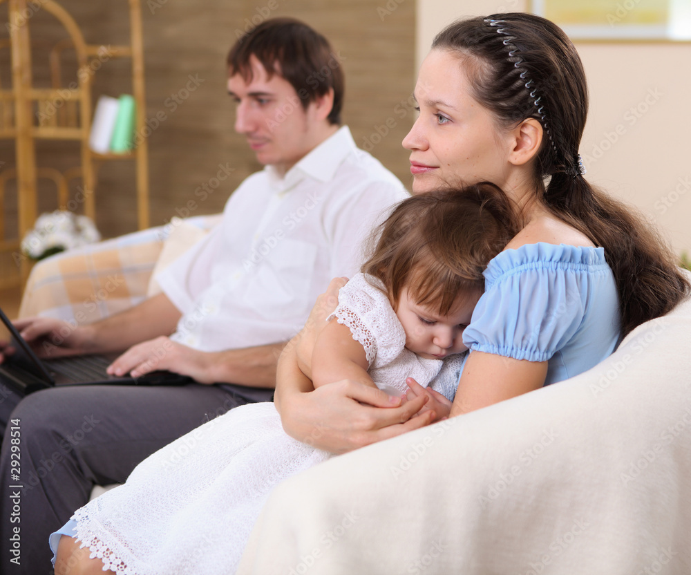 young mother with a daughter at home