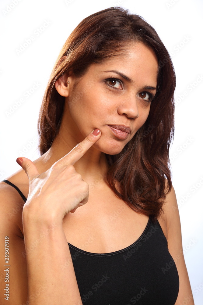 Smiling beautiful young woman pausing to think Smiling beautiful young woman pausing to think