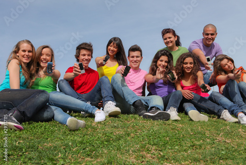 group of kids or teens with mobile or cell phones