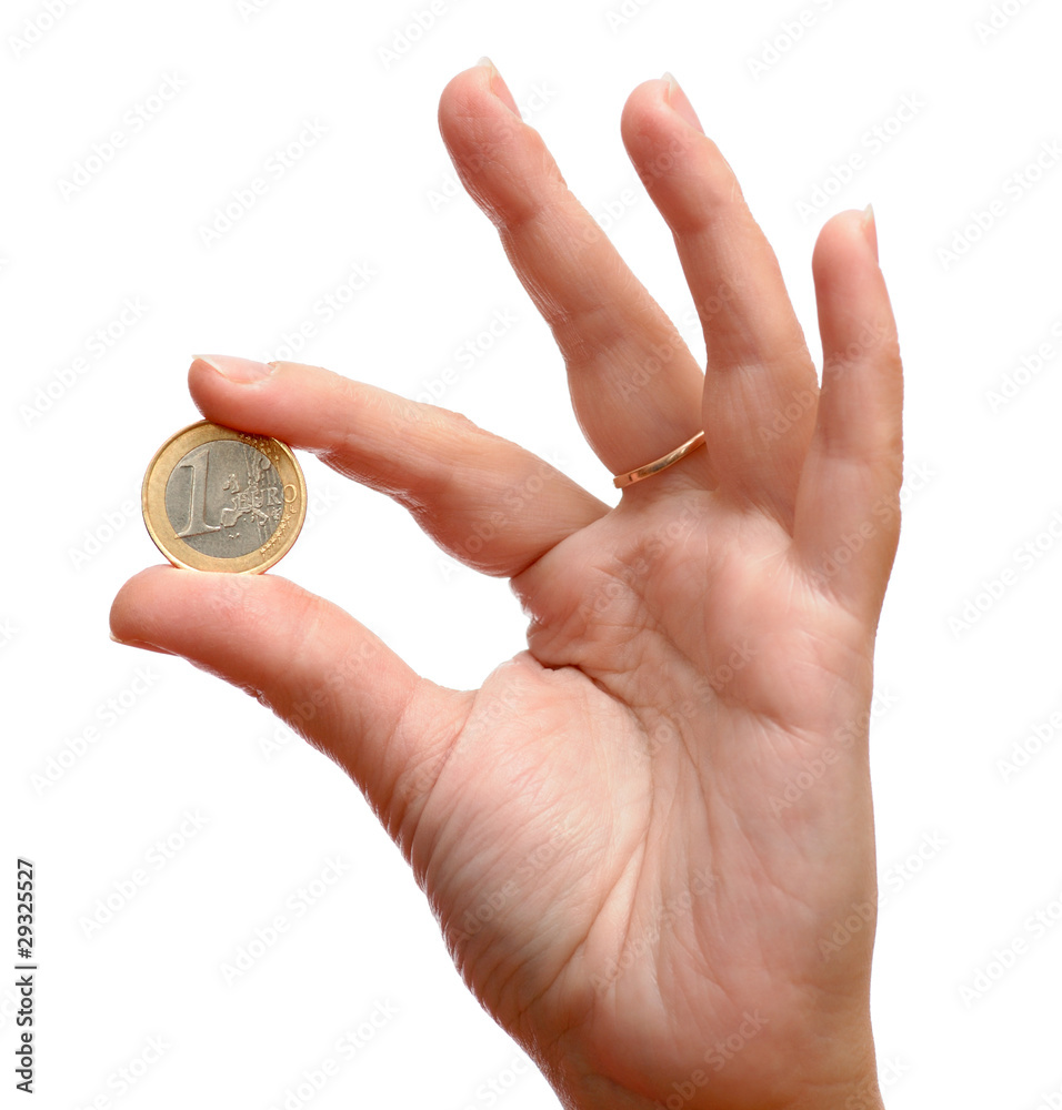 One euro coin in hand One euro coin in hand