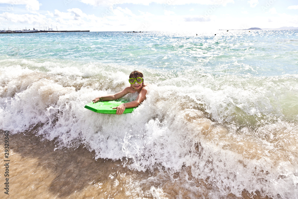 boy has fun with the surfboard