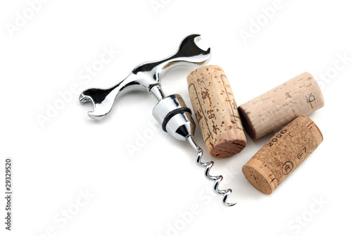 Corks and corkscrew over white