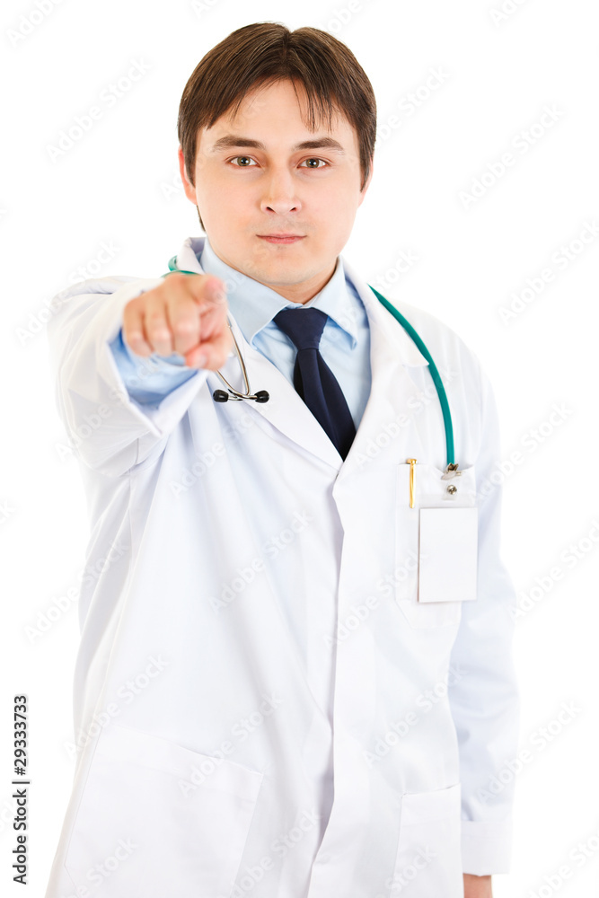 Confident young medical doctor pointing finger at you Confident young medical doctor pointing finger at you