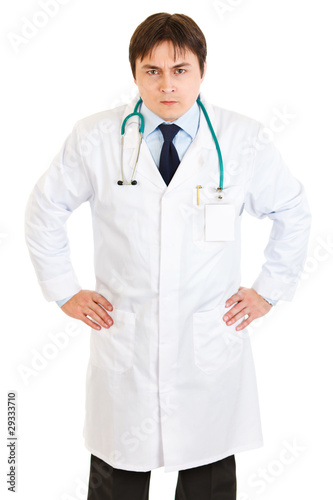 Stressful young medical doctor with stethoscope isolated