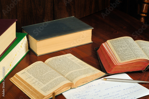 Greek and English Bibles open to John with study aids