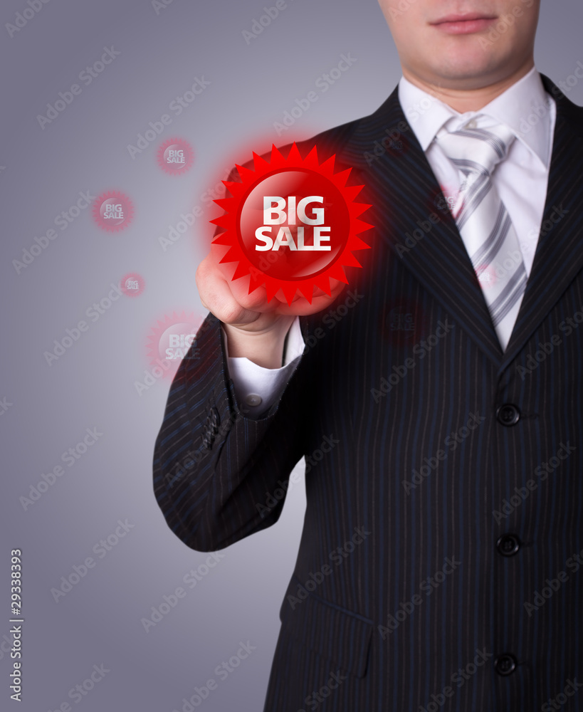 Man pressing BIG SALE button Man pressing BIG SALE button