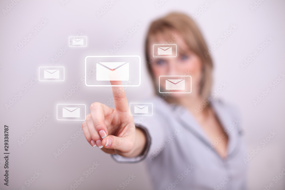 Woman pressing email envelope with numbers button Woman pressing email envelope with numbers button