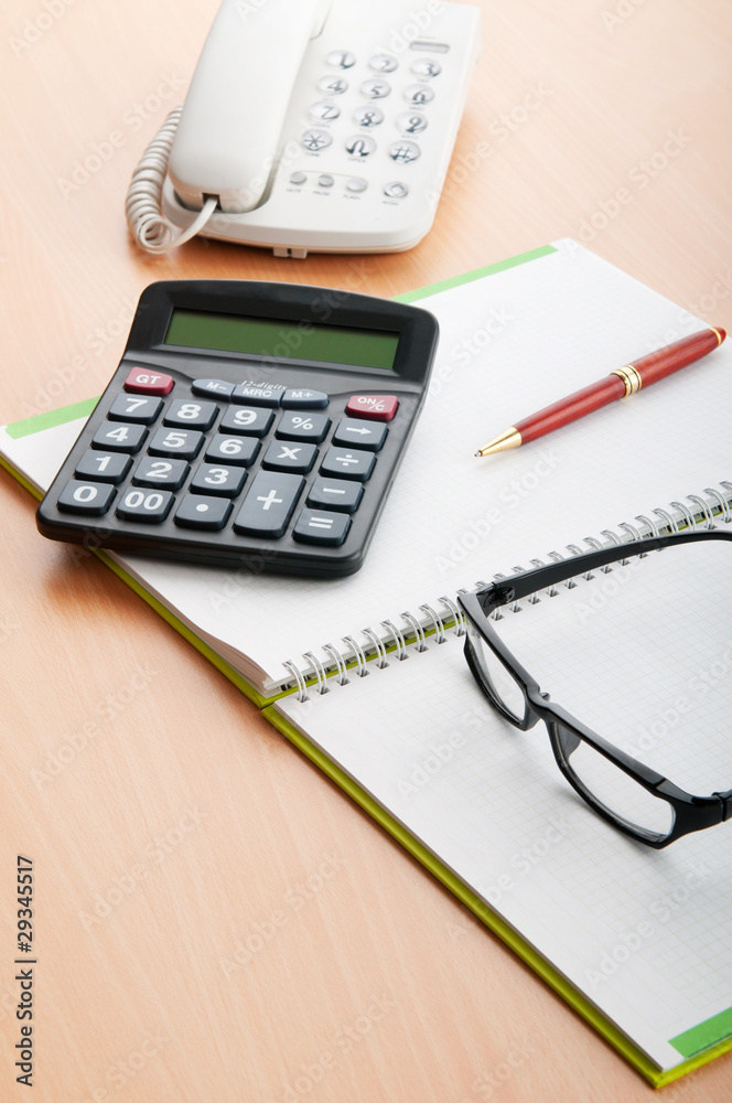 Business concept with notepad and calculator Business concept with notepad and calculator