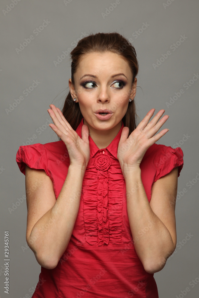 The girl with surprise stares to the left The girl with surprise stares to the left