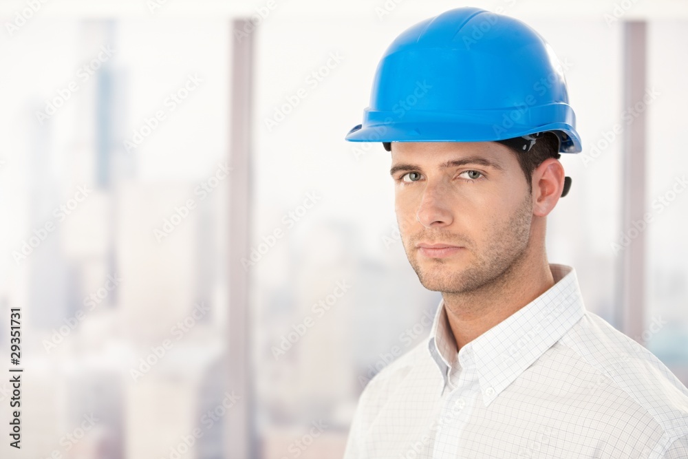 Handsome young engineer in hardhat Handsome young engineer in hardhat