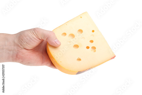 piece of cheese in a human hand