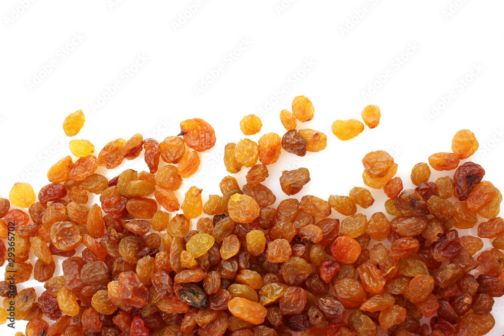 yellow raisins isolated on white