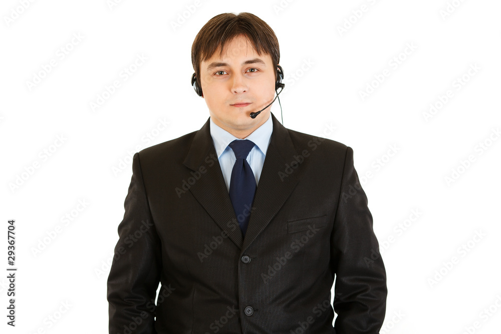 Smiling modern businessman with headset isolated on white. Smiling modern businessman with headset isolated on white.