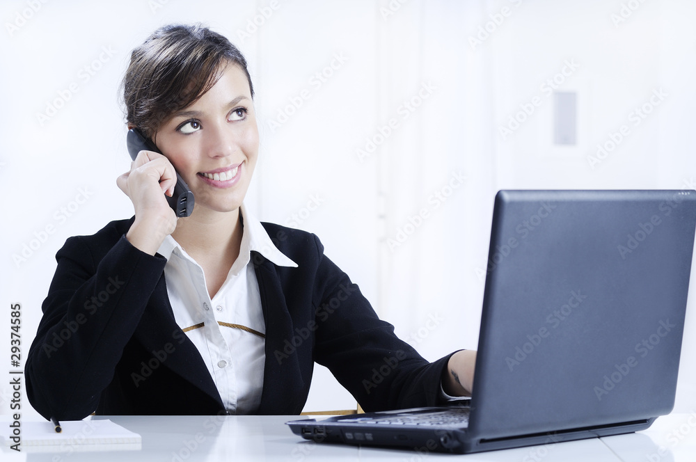 young woman working in office with telephone young woman working in office with telephone