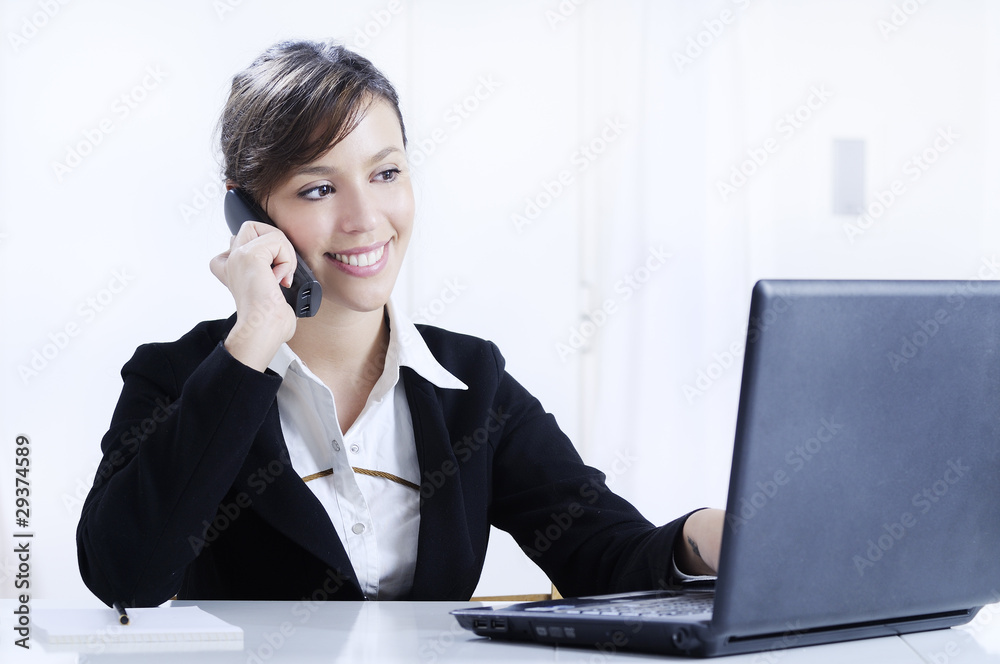 young woman working in office with telephone young woman working in office with telephone