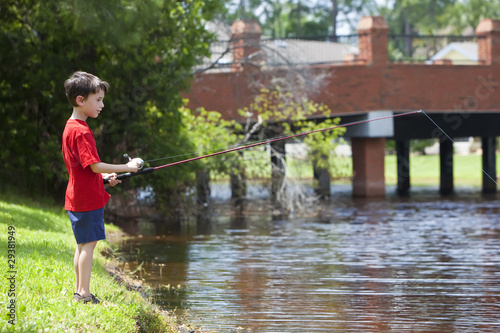 Young Boy Fishing On A RIver