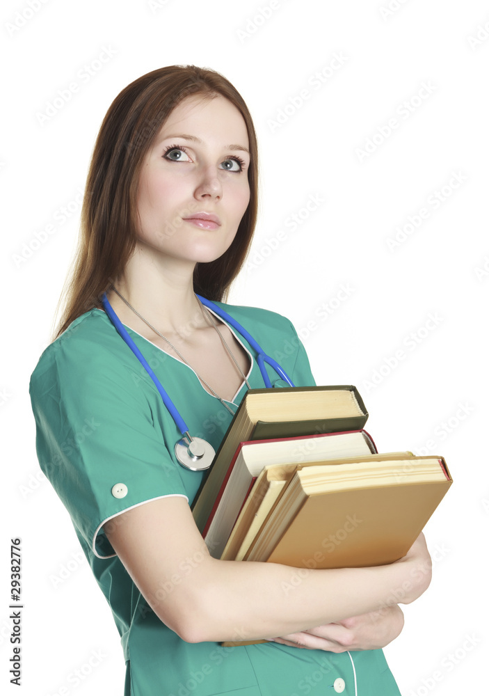 Portrait of kind female nurse in the green uniform with books Portrait of kind female nurse in the green uniform with books