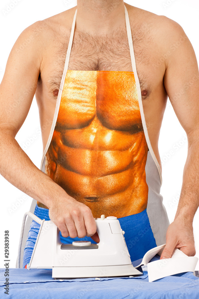 Mann - Hausmann mit Schürze beim Hemd bügeln Stock Photo | Adobe Stock